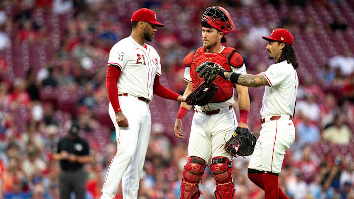 Cincinnati Reds starting pitcher Hunter Greene (21), Cincinnati Reds catcher Tyler Stephenson (37) and Cincinnati Reds second baseman Jonathan India (6) have a conference on the pitchers mound in the fifth inning of the MLB game between the Cincinnati Reds and the St. Louis Cardinals at Great American Ball Park in Cincinnati on Tuesday, Aug. 13, 2024. Cincinnati Reds starting pitcher Hunter Greene (21), Cincinnati Reds catcher Tyler Stephenson (37) and Cincinnati Reds second baseman Jonathan India (6) have a conference on the pitchers mound in the fifth inning of the MLB game between the Cincinnati Reds and the St. Louis Cardinals at Great American Ball Park in Cincinnati on Tuesday, Aug. 13, 2024.