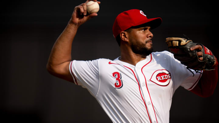 Cincinnati Reds third baseman Jeimer Candelario (3) throws to first for an error moving Cincinnati Reds pitcher Alexis Díaz (43) to second in the eighth inning of the MLB baseball game between the Cincinnati Reds and the Boston Red Sox at Great American Ball Park in Cincinnati on Saturday, June 22, 2024.