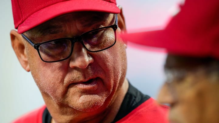 Cincinnati Reds manager Terry Francona (77) talks with bench coach/field coordinator Freddie Benavides (45) int eh dugout during the second inning of the MLB interleague game between the Cincinnati Reds and the Chicago White Sox at Great American Ball Park in Cincinnati on Tuesday, May 13, 2025. The score was 0-0 after three innings.