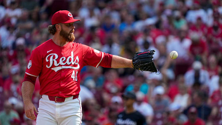 Cincinnati Reds relief pitcher Buck Farmer (46) get the ball back between pitches in the fourth inning of the MLB National League game between the Cincinnati Reds and the Miami Marlins at Great American Ball Park in downtown Cincinnati on Saturday, July 13, 2024. The Reds led 1-0 after two innings. The Reds won 10-6. Cincinnati Reds relief pitcher Buck Farmer (46) get the ball back between pitches in the fourth inning of the MLB National League game between the Cincinnati Reds and the Miami Marlins at Great American Ball Park in downtown Cincinnati on Saturday, July 13, 2024. The Reds led 1-0 after two innings. The Reds won 10-6.