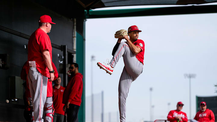 Cincinnati Reds director of pitching Derek Johnson (36) talks with pitcher Chase Burns (26) during a warmup session at the Cincinnati Reds player development complex in Goodyear, Ariz., on Wednesday, Feb. 11, 2026. Cincinnati Reds director of pitching Derek Johnson (36) talks with pitcher Chase Burns (26) during a warmup session at the Cincinnati Reds player development complex in Goodyear, Ariz., on Wednesday, Feb. 11, 2026.
