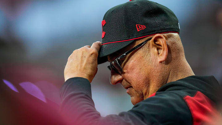Cincinnati Reds manager Terry Francona (77) adjusts his hat after the third out of the Reds half of the seventh inning of the MLB Interleague game between the Cincinnati Reds and the Houston Astros at Great American Ball Park in downtown Cincinnati on Friday, May 8, 2026. The Reds lost the series opener, 10-0.