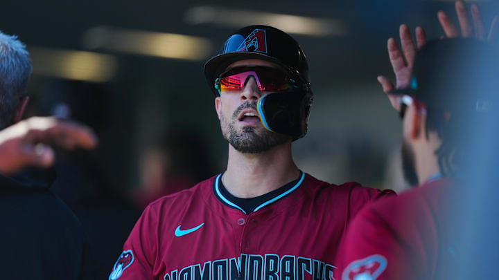 Sep 18, 2024; Denver, Colorado, USA; Arizona Diamondbacks outfielder Randal Grichuk (15) celebrates scoring a run in the first inning against the Colorado Rockies at Coors Field. Mandatory Credit: Ron Chenoy-Imagn Images