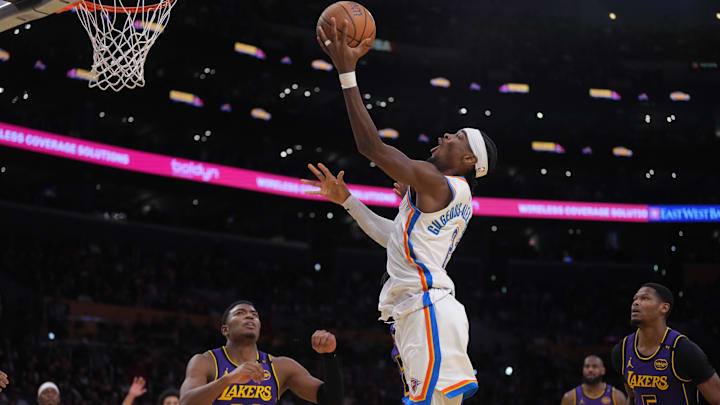Nov 29, 2024; Los Angeles, California, USA; Oklahoma City Thunder guard Shai Gilgeous-Alexander (2) shoots the ball against the Los Angeles Lakers in the second half at Crypto.com Arena. Mandatory Credit: Kirby Lee-Imagn Images