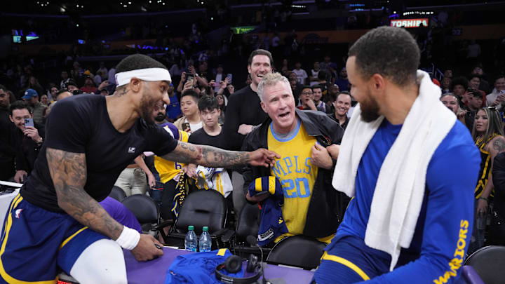 Golden State Warriors guard Stephen Curry and guard Gary Payton II (0) after the game against the Los Angeles Lakers at Crypto.com Arena. 