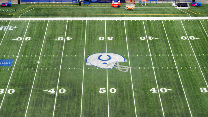Feb 28, 2024; Indianapolis, IN, USA; The Indianapolis Colts helmet logo at midfield of Lucas Oil Stadium. Mandatory Credit: Kirby Lee-Imagn Images