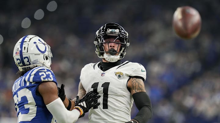 Jan 5, 2025; Indianapolis, Indiana, USA; A pass intended for Jacksonville Jaguars wide receiver Parker Washington (11) goes incomplete as Indianapolis Colts cornerback Kenny Moore II (23) provides defensive coverage during a game against the Jacksonville Jaguars at Lucas Oil Stadium. Mandatory Credit: Christine Tannous/USA TODAY Network via Imagn Images