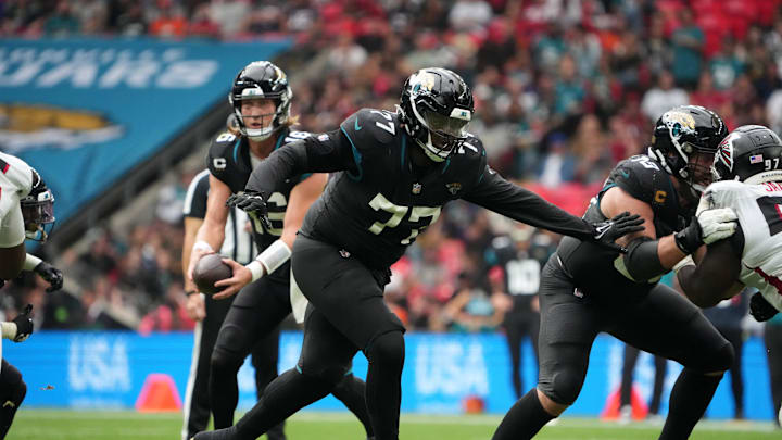 Oct 1, 2023; London, United Kingdom; Jacksonville Jaguars offensive tackle Anton Harrison (77) against the Atlanta Falcons in the second half during an NFL International Series game at Wembley Stadium. Mandatory Credit: Kirby Lee-Imagn Images