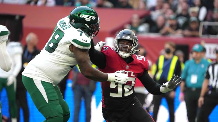 Oct 10, 2021; London, England, United Kingdom; Atlanta Falcons linebacker Adetokunbo Ogundeji (92) tries to get past New York Jets offensive tackle Morgan Moses (78) in the second half during an NFL International Series game at Tottenham Hotspur Stadium. The Falcons defeated the Jets 27-20. Oct 10, 2021; London, England, United Kingdom; Atlanta Falcons linebacker Adetokunbo Ogundeji (92) tries to get past New York Jets offensive tackle Morgan Moses (78) in the second half during an NFL International Series game at Tottenham Hotspur Stadium. The Falcons defeated the Jets 27-20.