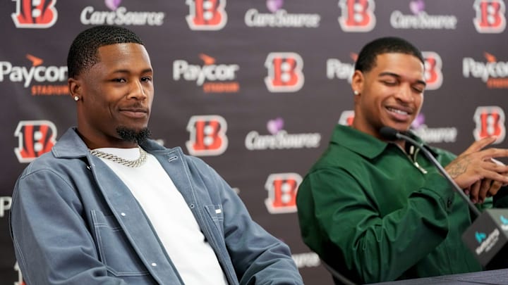 Ja’marr Chase reacts to Tee Higgins saying he plans to send his new money on an aquarium built into the wall of his home during a press conference to announce the signing of new contracts for Cincinnati Bengals wide receivers Ja’Marr Chase and Tee Higgins at Paycor Stadium in downtown Cincinnati on Tuesday, March 18, 2025. Chase becomes the new highest-paid non-quarterback player in the NFL.