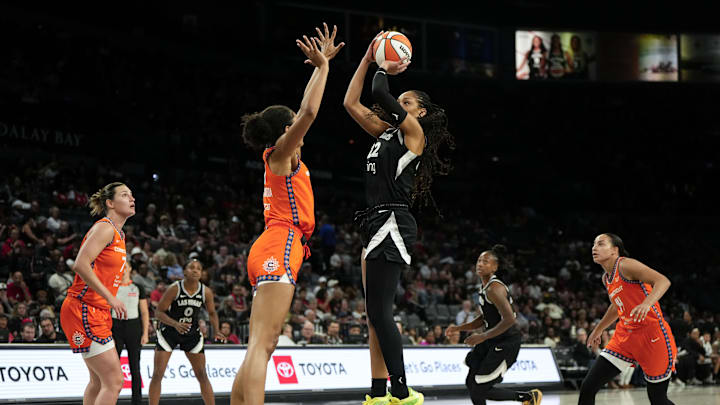 Jun 25, 2025; Las Vegas, Nevada, USA; Las Vegas Aces center A'ja Wilson (22) shoots the ball against Connecticut Sun center Olivia Nelson-Ododa (10) during the second half of a WNBA basketball game at Michelob Ultra Arena. Jun 25, 2025; Las Vegas, Nevada, USA; Las Vegas Aces center A'ja Wilson (22) shoots the ball against Connecticut Sun center Olivia Nelson-Ododa (10) during the second half of a WNBA basketball game at Michelob Ultra Arena.
