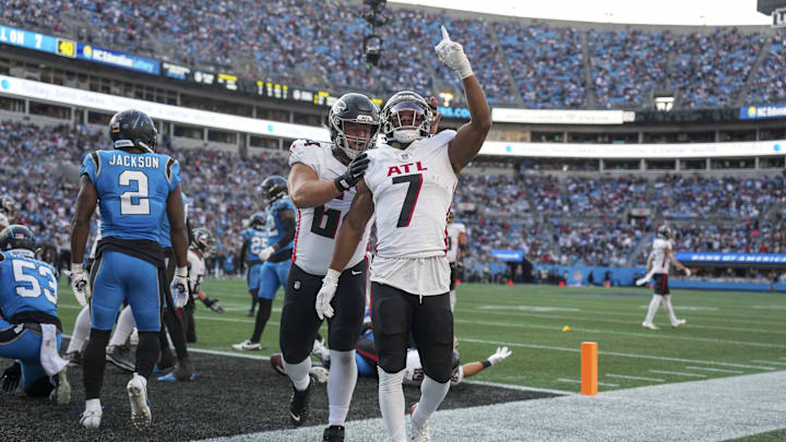 Oct 13, 2024; Charlotte, North Carolina, USA;  Atlanta Falcons running back Bijan Robinson (7) reacts to his touchdown against the Carolina Panthers during the second quarter at Bank of America Stadium. Mandatory Credit: Jim Dedmon-Imagn Images