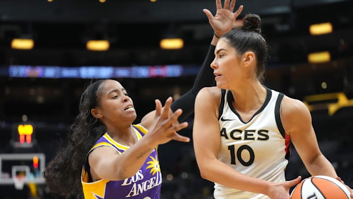 May 25, 2023; Los Angeles, California, USA; Las Vegas Aces guard Kelsey Plum (10) is defended by LA Sparks guard Jordin Canada (21) during the second half at Crypto.com Arena. Mandatory Credit: Kirby Lee-Imagn Images