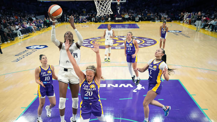 May 23, 2025; Los Angeles, California, USA; Golden State Valkyries center Temi Fagbenle (14) shoots the ball against LA Sparks guard Kelsey Plum (10), guard Julie Allemand (20) and forward Dearica Hamby (5) in the second half at Crypto.com Arena. Mandatory Credit: Kirby Lee-Imagn Images