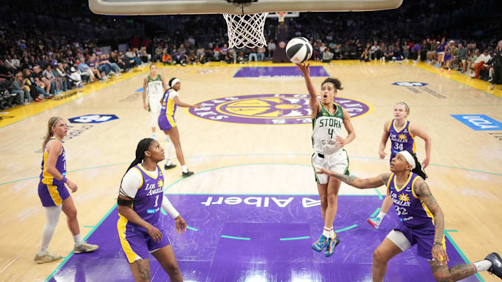 Jun 17, 2025; Los Angeles, California, USA; Seattle Storm guard Skylar Diggins (4) shoots the ball against LA Sparks forward Sania Feagin (1) and forward Emma Cannon (32) in the second half at Crypto.com Arena. Mandatory Credit: Kirby Lee-Imagn Images