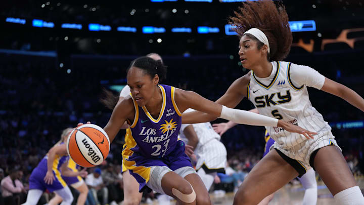 May 25, 2025; Los Angeles, California, USA; LA Sparks forward Azura Stevens (23) and Chicago Sky forward Angel Reese (5) reach for the ball in the second half at Crypto.com Arena. Mandatory Credit: Kirby Lee-Imagn Images