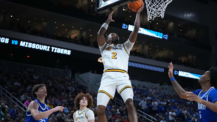 Mar 20, 2025; Wichita, KS, USA; Missouri Tigers guard Tamar Bates (2) shoots against Drake Bulldogs guard Isaia Howard (23) and guard Tavion Banks (6) in the second half of a first round men’s NCAA Tournament game at Intrust Bank Arena. Mandatory Credit: Kirby Lee-Imagn Images Mar 20, 2025; Wichita, KS, USA; Missouri Tigers guard Tamar Bates (2) shoots against Drake Bulldogs guard Isaia Howard (23) and guard Tavion Banks (6) in the second half of a first round men’s NCAA Tournament game at Intrust Bank Arena. Mandatory Credit: Kirby Lee-Imagn Images