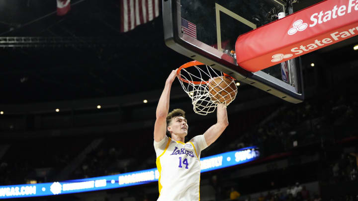 Jul 15, 2024; Las Vegas, NV, USA; Los Angeles Lakers center Colin Castleton (14) dunks the ball against the Boston Celtics during the first half at Thomas & Mack Center. Mandatory Credit: Lucas Peltier-USA TODAY Sports Jul 15, 2024; Las Vegas, NV, USA; Los Angeles Lakers center Colin Castleton (14) dunks the ball against the Boston Celtics during the first half at Thomas & Mack Center. Mandatory Credit: Lucas Peltier-USA TODAY Sports