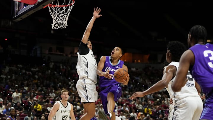 Jul 14, 2025; Las Vegas, NV, USA; Utah Jazz forward John Tonje (17) drives towards the basket against San Antonio Spurs forward Carter Bryant (11) during the first half of a NBA basketball game at the Thomas & Mack Center. Jul 14, 2025; Las Vegas, NV, USA; Utah Jazz forward John Tonje (17) drives towards the basket against San Antonio Spurs forward Carter Bryant (11) during the first half of a NBA basketball game at the Thomas & Mack Center.