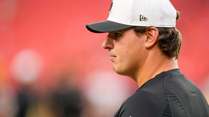 Cincinnati Bengals defensive end Trey Hendrickson (91) talks with director of player personnel Duke Tobin before the first quarter of the NFL Preseason Week 2 game between the Washington Commanders and the Cincinnati Bengals at Northwest Stadium in Landover, Md., on Monday, Aug. 18, 2025.
