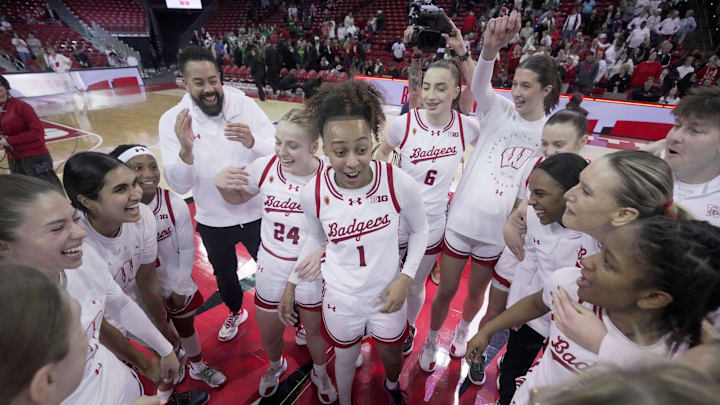 Wisconsin guard Destiny Howell is surrounded by her teammates after scoring 39 points after their overtime win Sunday, January 18, 2026 at the Kohl Center in Madison, Wisconsin. Wisconsin beat Oregon 94-92 in double overtime.