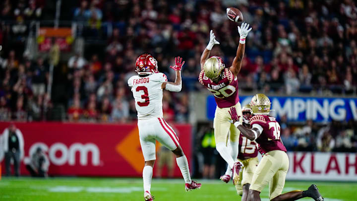 Florida State Seminoles defensive back Azareye'h Thomas (20) attempts to intercept a pass against Oklahoma.