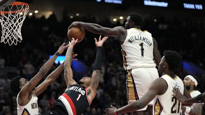 Oct 25, 2024; Portland, Oregon, USA; New Orleans Pelicans power forward Zion Williamson (1) blocks a shot by Portland Trail Blazers shooting guard Anfernee Simons (1) during the second half at Moda Center. Mandatory Credit: Soobum Im-Imagn Images