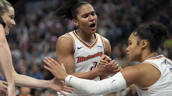 Sep 23, 2025; Minneapolis, Minnesota, USA; Phoenix Mercury forward Alyssa Thomas (25) celebrates with forward Satou Sabally (0) against the Minnesota Lynx in the second half during game two of the second round for the 2025 WNBA Playoffs at Target Center. Mandatory Credit: Jesse Johnson-Imagn Images