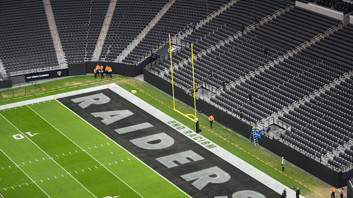 Nov 26, 2023; Paradise, Nevada, USA; The words End Racism and Raiders logo in the end zone at Allegiant Stadium. Mandatory Credit: Kirby Lee-USA TODAY Sports Nov 26, 2023; Paradise, Nevada, USA; The words End Racism and Raiders logo in the end zone at Allegiant Stadium. Mandatory Credit: Kirby Lee-USA TODAY Sports
