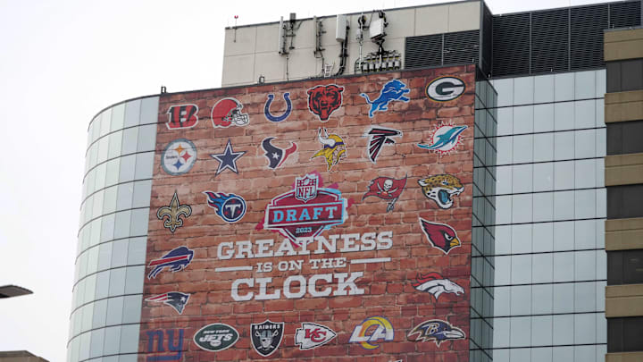 Apr 26, 2023; Kansas City, MO, USA; Signage promoting the 2023 NFL Draft with team logos in downtown. Mandatory Credit: Kirby Lee-Imagn Images