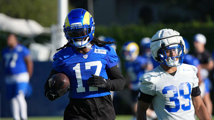 Jul 23, 2025; Los Angeles, CA, USA; Los Angeles Rams receiver Davante Adams (17) carries the ball against safety Malik Dixon-Williams (39) during training camp at Loyola Marymount University. Mandatory Credit: Kirby Lee-Imagn Images