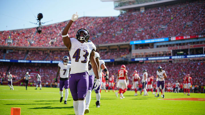 Sep 28, 2025; Kansas City, Missouri, USA; Baltimore Ravens running back Justice Hill (43) celebrates after scoring a touchdown during the first quarter against the Kansas City Chiefs at GEHA Field at Arrowhead Stadium. Mandatory Credit: Jay Biggerstaff-Imagn Images
