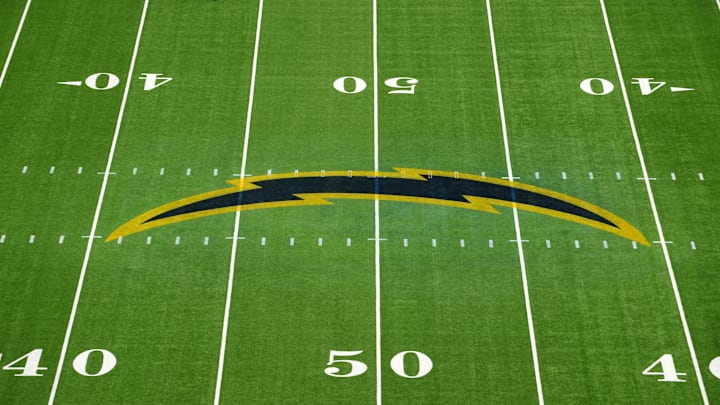 Nov 25, 2024; Inglewood, California, USA; The Los Angeles Chargers bolt logo at midfield at SoFi Stadium. Mandatory Credit: Kirby Lee-Imagn Images