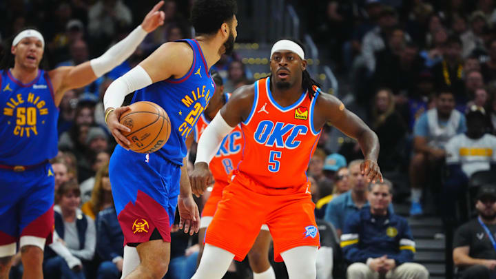 Dec 16, 2023; Denver, Colorado, USA; Oklahoma City Thunder guard Luguentz Dort (5) defends Denver
