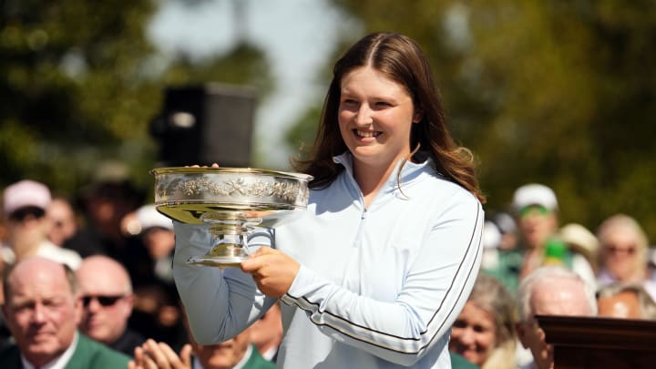 Apr 6, 2024; Augusta, Georgia, USA;  Lottie Woad holds the winner's trophy during a ceremony after the August National Women’s Amateur.
