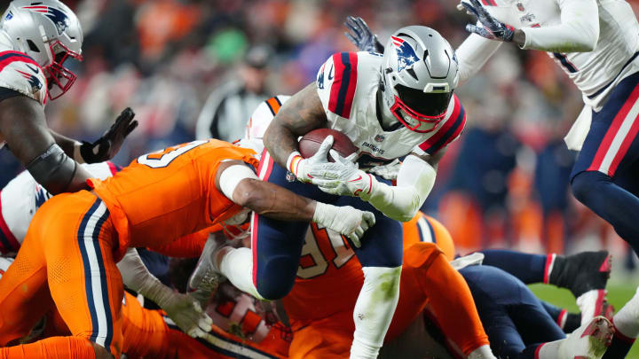 Dec 24, 2023; Denver, Colorado, USA; New England Patriots running back Ezekiel Elliott (15) carries Dec 24, 2023; Denver, Colorado, USA; New England Patriots running back Ezekiel Elliott (15) carries