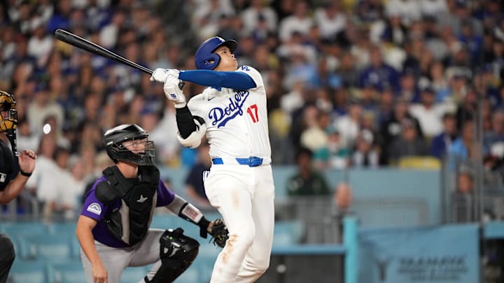 Los Angeles Dodgers designated hitter Shohei Ohtani hits a two-run home run in the fifth inning of Friday's win over the Colorado Rockies. 