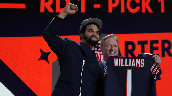 Caleb Williams poses with jersey and NFL commissioner Roger Goodell after being chosen as the No. 1 pick in the first round during the 2024 NFL Draft. Caleb Williams poses with jersey and NFL commissioner Roger Goodell after being chosen as the No. 1 pick in the first round during the 2024 NFL Draft.