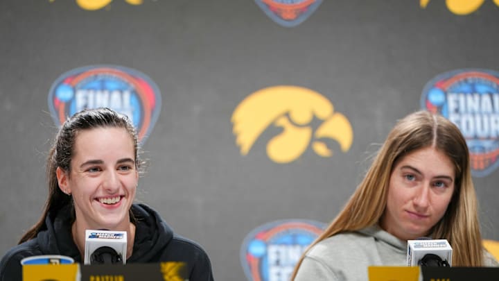 Iowa Hawkeyes guard Caitlin Clark and guard Kate Martin (20) take questions before the Final Four round of the NCAA Women's Basketball Tournament, Thursday, April 4, 2024 in Cleveland.