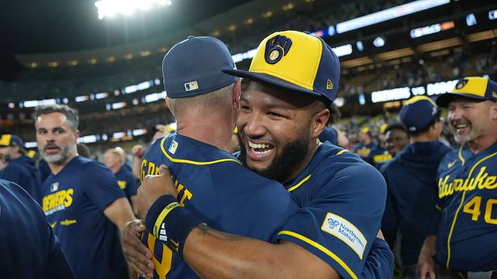 Milwaukee Brewers outfielder Jackson Chourio (11) celebrates with teammates