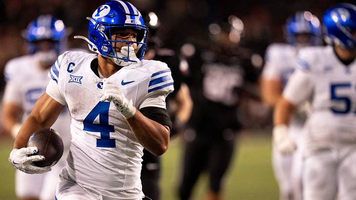 BYU Cougars running back LJ Martin (4) scores a touchdown in the fourth quarter of the NCAA football game between the Cincinnati Bearcats and BYU Cougars at Nippert Stadium in Cincinnati on Nov. 22, 2025. BYU Cougars running back LJ Martin (4) scores a touchdown in the fourth quarter of the NCAA football game between the Cincinnati Bearcats and BYU Cougars at Nippert Stadium in Cincinnati on Nov. 22, 2025.