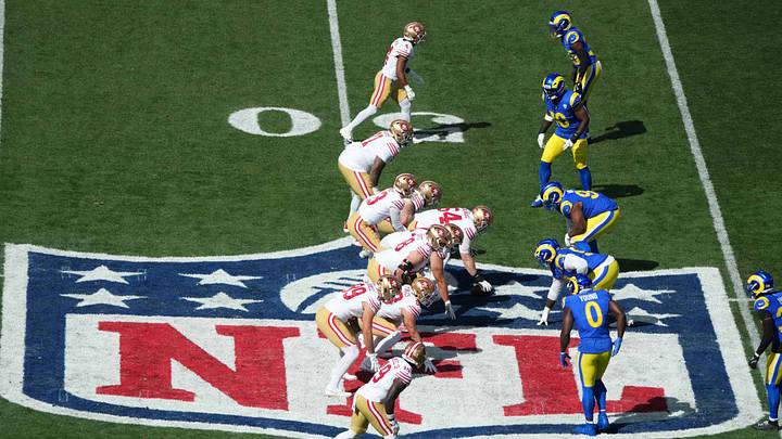 Sep 11, 2026; Melbourne, Victoria, Australia; A general overall view as San Francisco 49ers quarterback Brock Purdy (13) takes the snap on the NFL shield logo in the first quarter against the Los Angeles Rams during the 2026 NFL Melbourne Game at Melbourne Cricket Ground. Mandatory Credit: Kirby Lee-Imagn Images Sep 11, 2026; Melbourne, Victoria, Australia; A general overall view as San Francisco 49ers quarterback Brock Purdy (13) takes the snap on the NFL shield logo in the first quarter against the Los Angeles Rams during the 2026 NFL Melbourne Game at Melbourne Cricket Ground. Mandatory Credit: Kirby Lee-Imagn Images