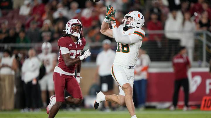 Sep 4, 2026; Stanford, California, USA; Miami Hurricanes wide receiver Cooper Barkate (18) prepares ro make a touchdown reception as Stanford Cardinal defensive back Lasiah Jackson (33) defends during the third quarter at Stanford Stadium. Mandatory Credit: Stan Szeto-Imagn Images Sep 4, 2026; Stanford, California, USA; Miami Hurricanes wide receiver Cooper Barkate (18) prepares ro make a touchdown reception as Stanford Cardinal defensive back Lasiah Jackson (33) defends during the third quarter at Stanford Stadium. Mandatory Credit: Stan Szeto-Imagn Images
