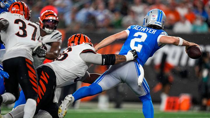 Detroit Lions quarterback Luke Altmyer (2) is brought down by Cincinnati Bengals defensive tackle Landon Robinson (96) Detroit Lions quarterback Luke Altmyer (2) is brought down by Cincinnati Bengals defensive tackle Landon Robinson (96)