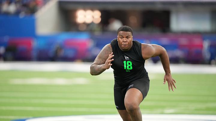 Mar 1, 2026; Indianapolis, IN, USA; Illinois offensive lineman JC Davis (OL18) during the NFL Scouting Combine at Lucas Oil Stadium. Mar 1, 2026; Indianapolis, IN, USA; Illinois offensive lineman JC Davis (OL18) during the NFL Scouting Combine at Lucas Oil Stadium.
