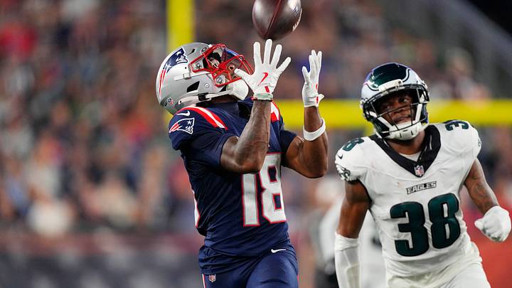 Aug 22, 2026; Foxborough, Massachusetts, USA;  New England Patriots wide receiver Kyle Williams (18) catches a pass against Philadelphia Eagles cornerback Ambry Thomas (38) and runs for a touchdown during the first half at Gillette Stadium.  Mandatory Credit: Gregory Fisher-Imagn Images