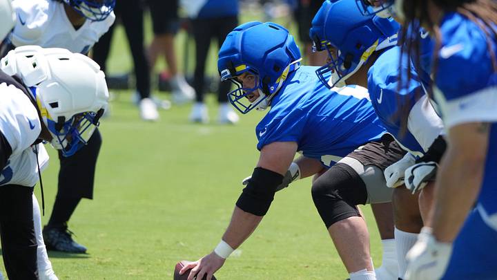 Jun 2, 2026; Woodland Hills, CA, USA; Helmets with guardian caps at the line of scrimmage as Los Angeles Rams lineman Coleman Shelton snaps the ball during organized team activities at Rams Practice Facility. Mandatory Credit: Kirby Lee-Imagn Images Jun 2, 2026; Woodland Hills, CA, USA; Helmets with guardian caps at the line of scrimmage as Los Angeles Rams lineman Coleman Shelton snaps the ball during organized team activities at Rams Practice Facility. Mandatory Credit: Kirby Lee-Imagn Images