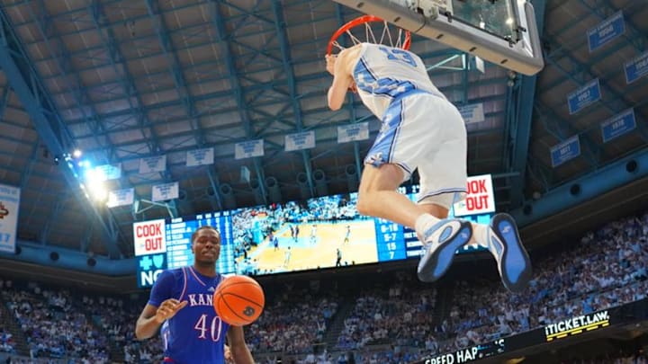 Nov 7, 2025; Chapel Hill, North Carolina, USA; North Carolina Tar Heels center Henri Veesaar (13) scores as Kansas Jayhawks forward Flory Bidunga (40) defends in the second half at Dean E. Smith Center. Mandatory Credit: Bob Donnan-Imagn Images Nov 7, 2025; Chapel Hill, North Carolina, USA; North Carolina Tar Heels center Henri Veesaar (13) scores as Kansas Jayhawks forward Flory Bidunga (40) defends in the second half at Dean E. Smith Center. Mandatory Credit: Bob Donnan-Imagn Images