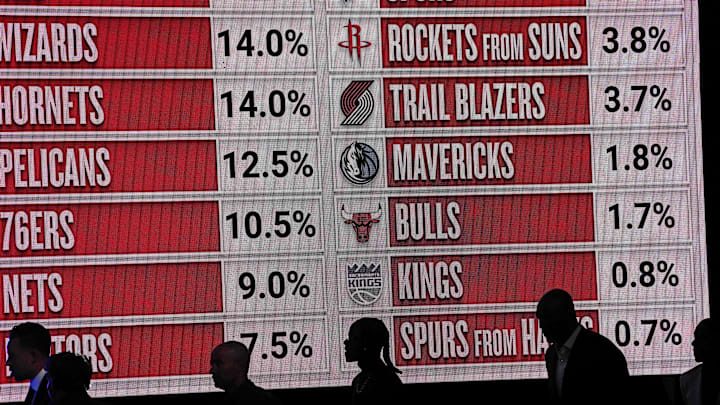 May 12, 2025; Chicago, Illinois, US; Representitives of the NBA teams walk onto the stage during the 2025 NBA Draft Lottery at McCormick Place. Mandatory Credit: David Banks-Imagn Images