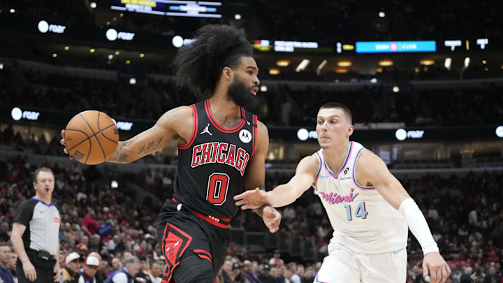 Apr 9, 2025; Chicago, Illinois, USA; Miami Heat guard Tyler Herro (14) defends Chicago Bulls guard Coby White (0) during the first quarter at United Center. Mandatory Credit: David Banks-Imagn Images